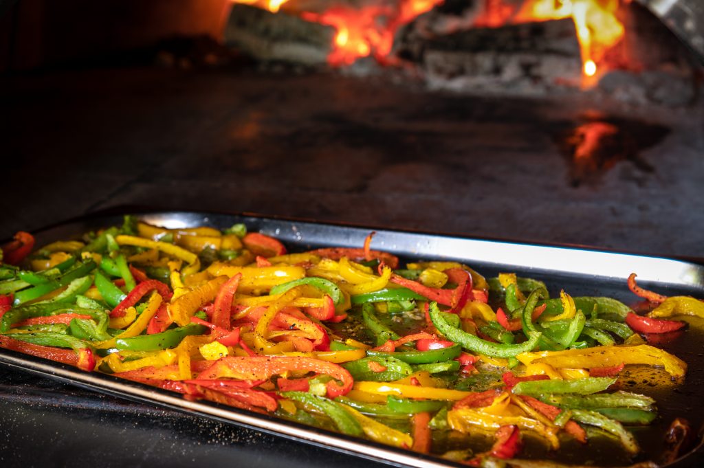 A tray of freshly sliced peppers at The Quiet Bite